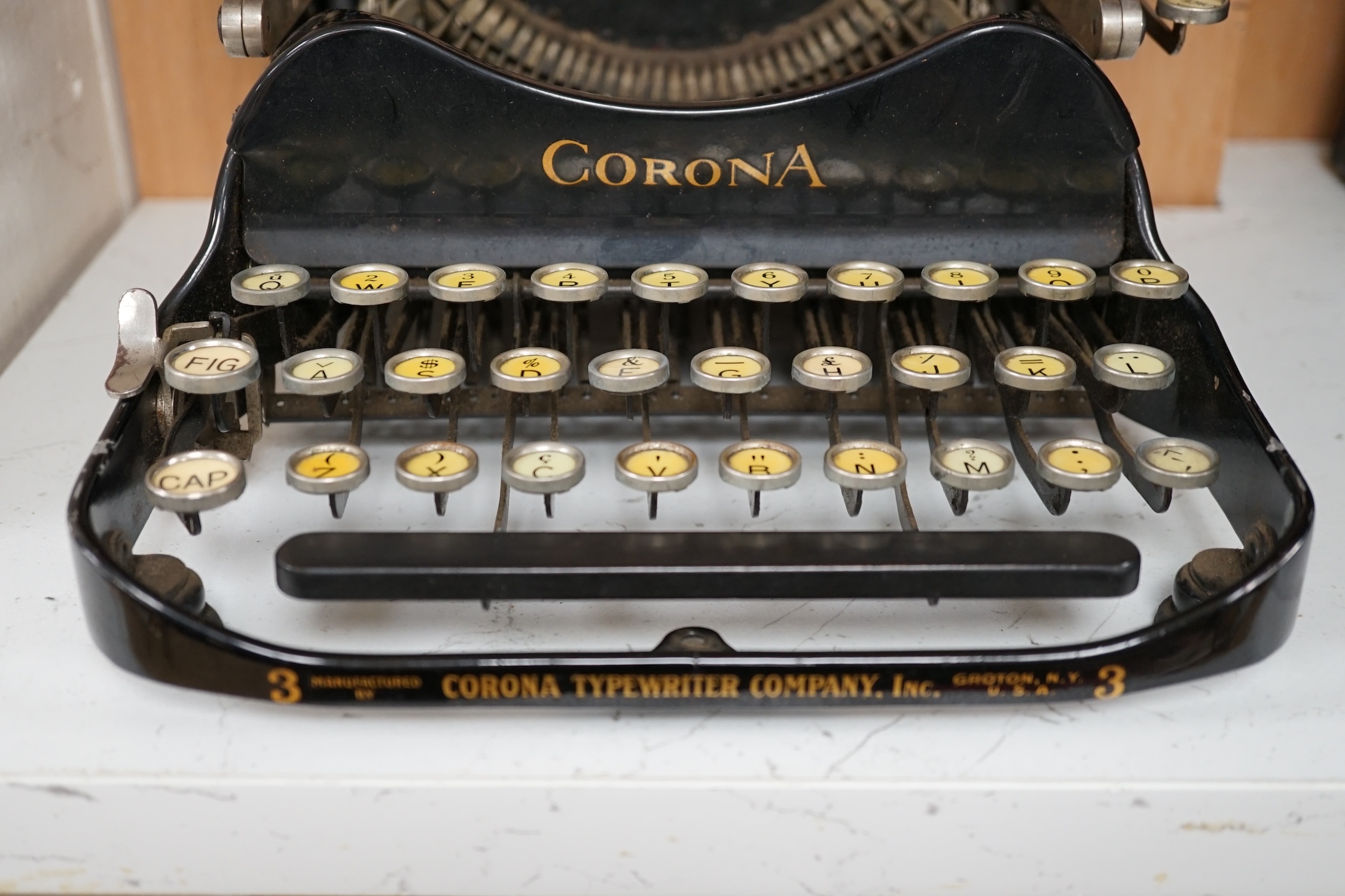 A cased Corona travelling typewriter. Condition - fair